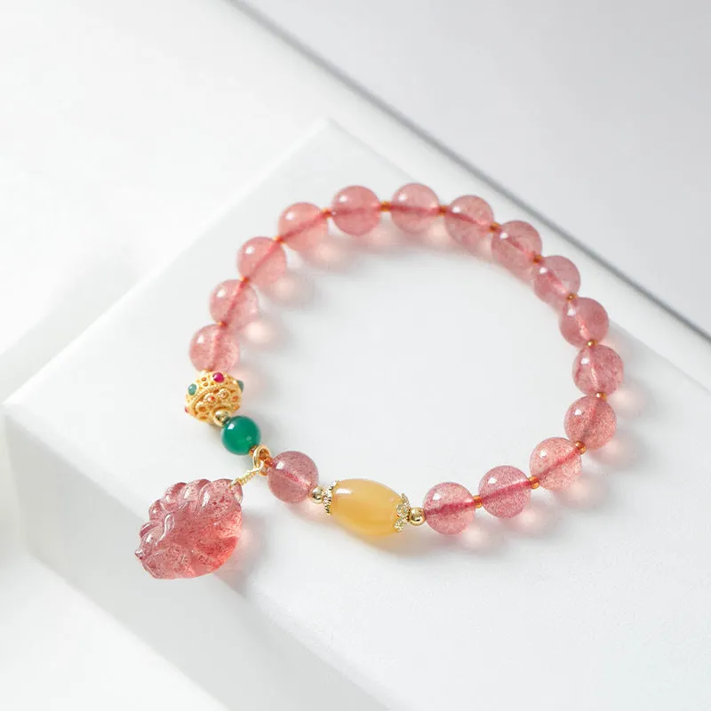Polished crystal strawberry quartz beaded bracelet in a Nine Tail Fox style for women.