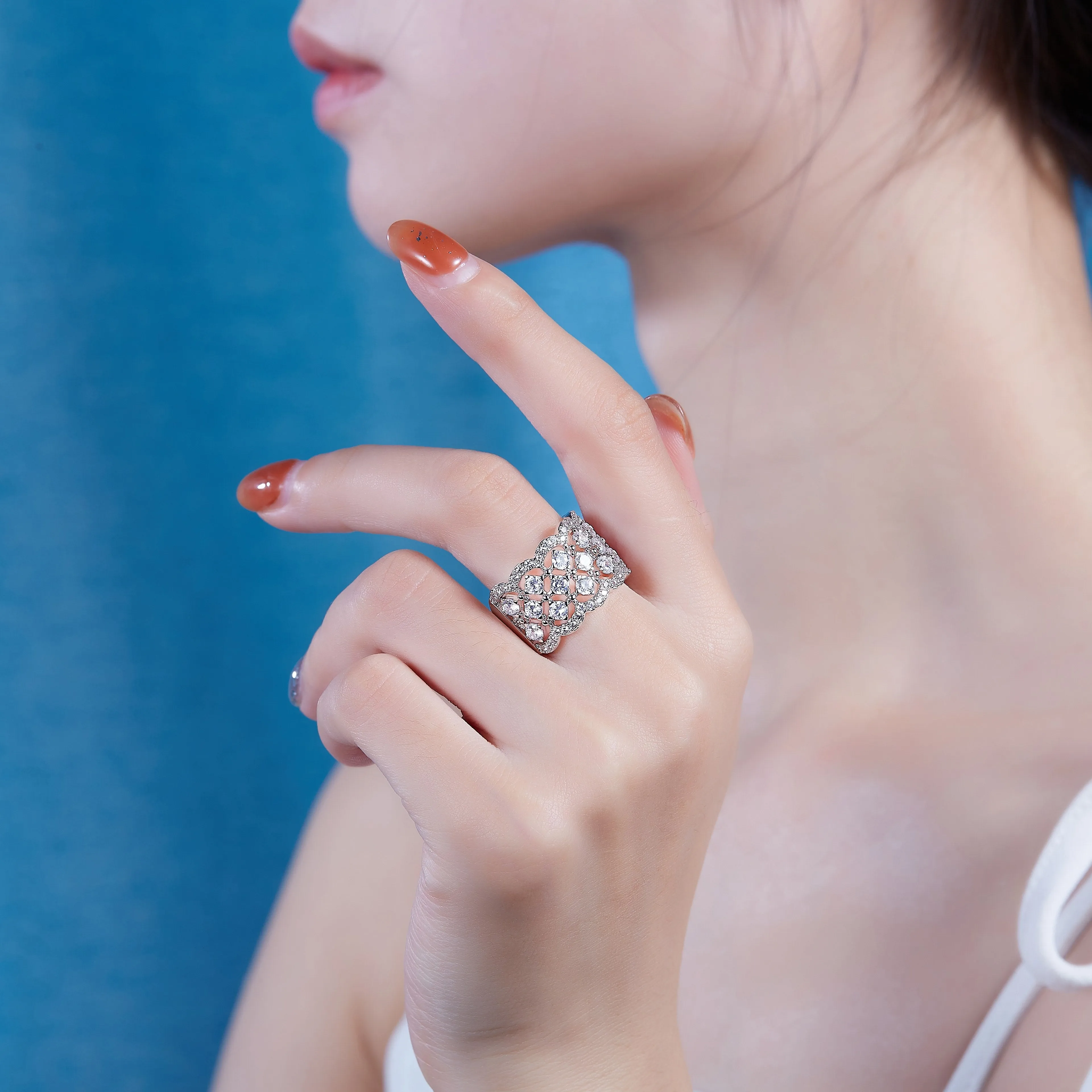 Lace Snowflake moissanite wedding ring set in S925 silver with platinum plating on a black background