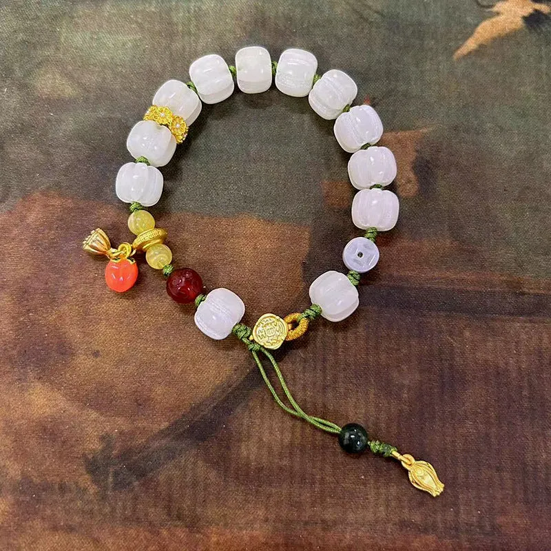 White jade Bodhi bracelet with hand-woven rope, lotus beads, and large pumpkin beads on an open ring design.
