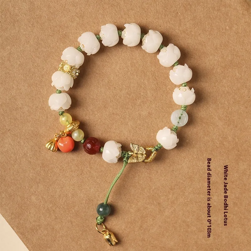 White jade Bodhi bracelet with hand-woven rope, lotus beads, and large pumpkin beads on an open ring design.