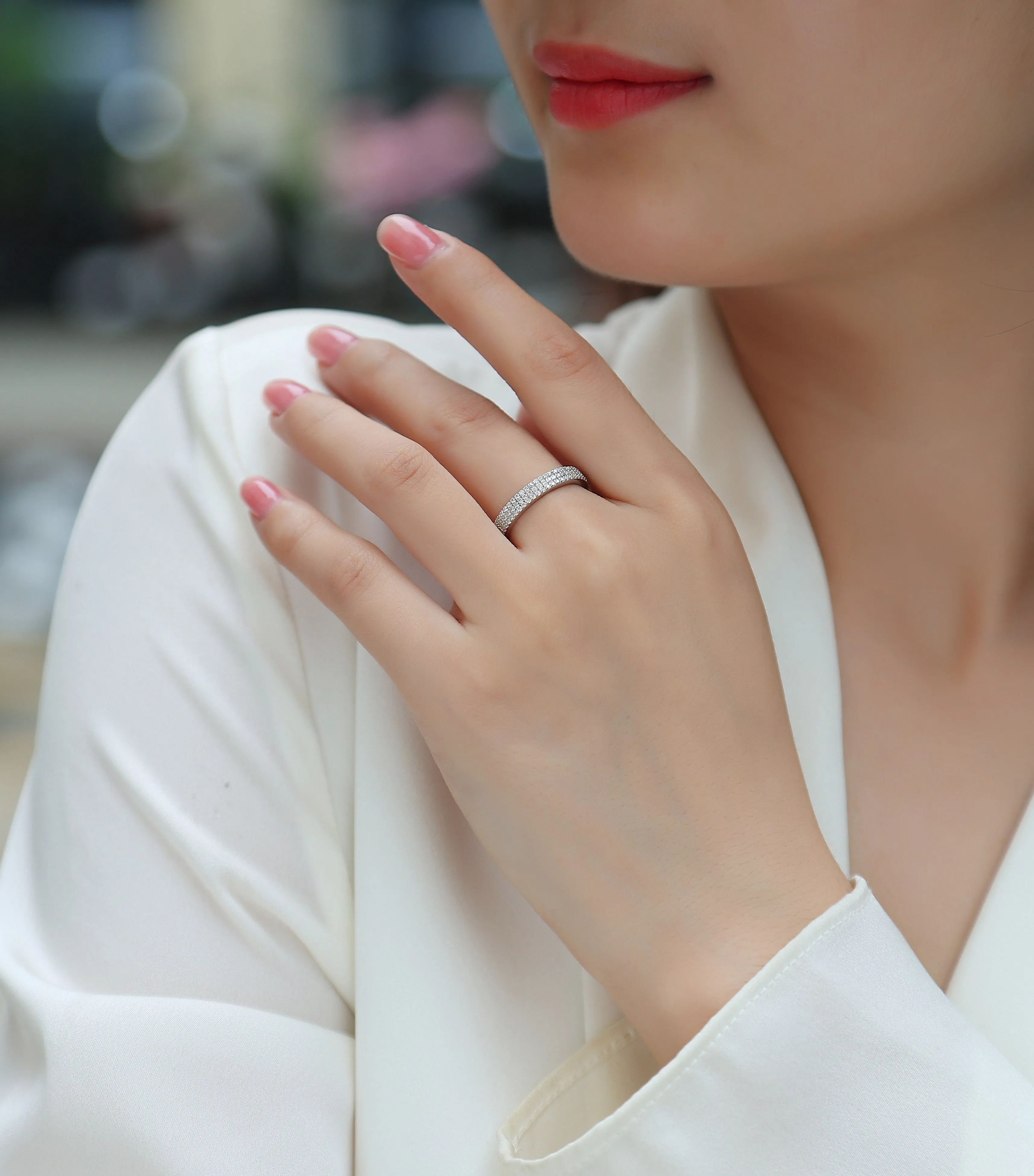 Moissanite wedding ring set in S925 silver with platinum plating, yellow gold colour, on white background