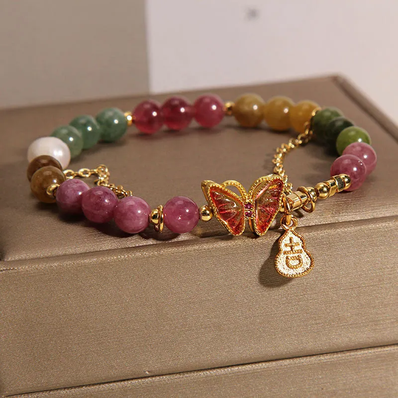 Natural jade coloured agate bracelet with butterfly and gourd pendant.
