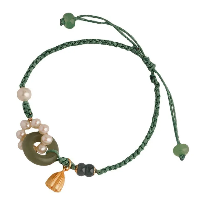 Hand-woven women's watch band with pearl details and a peace buckle in a retro style.