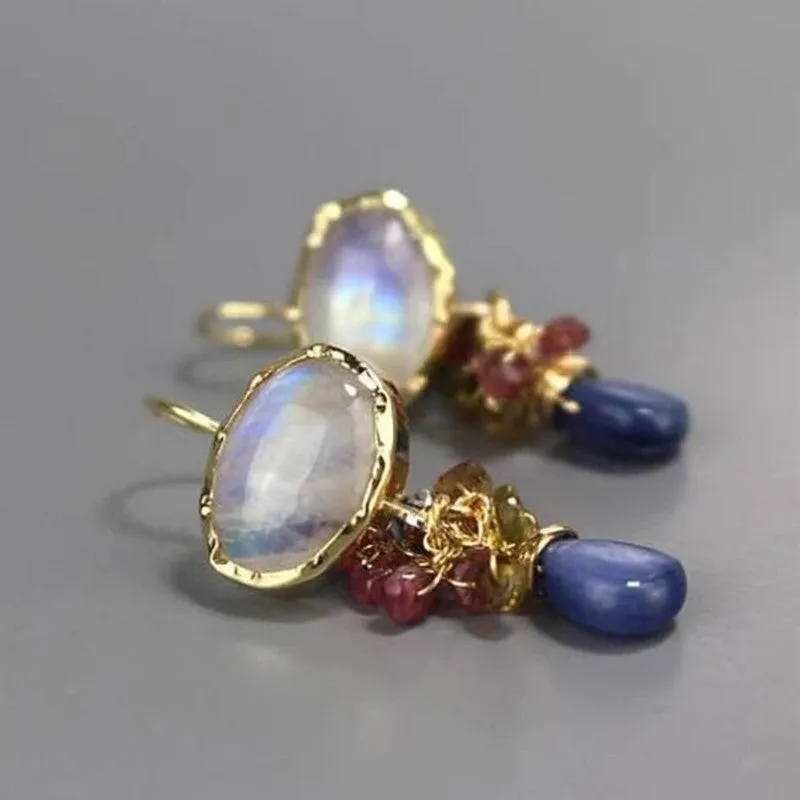 Retro vertical earrings with colored stones in geometric copper design, micro-set style