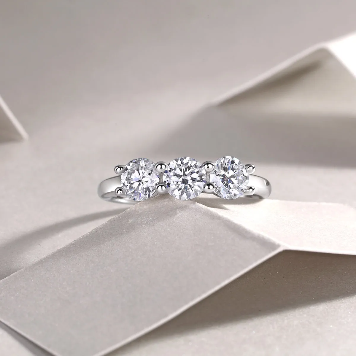 0.5 carat moissanite wedding ring set in S925 silver with platinum plating, gold colour, on white background