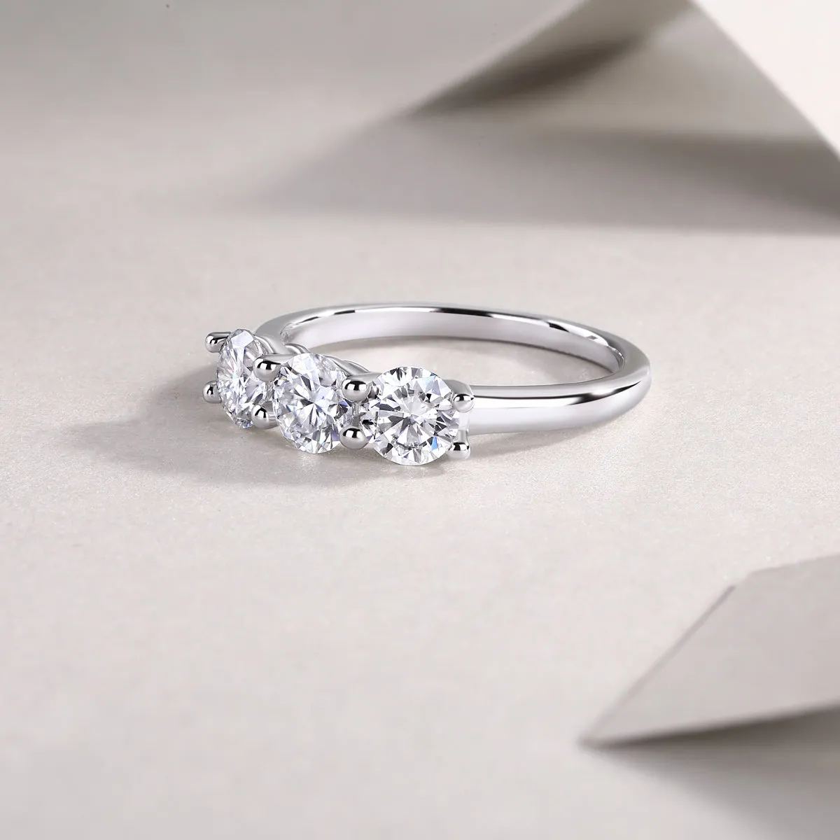 0.5 carat moissanite wedding ring set in S925 silver with platinum plating, gold colour, on white background