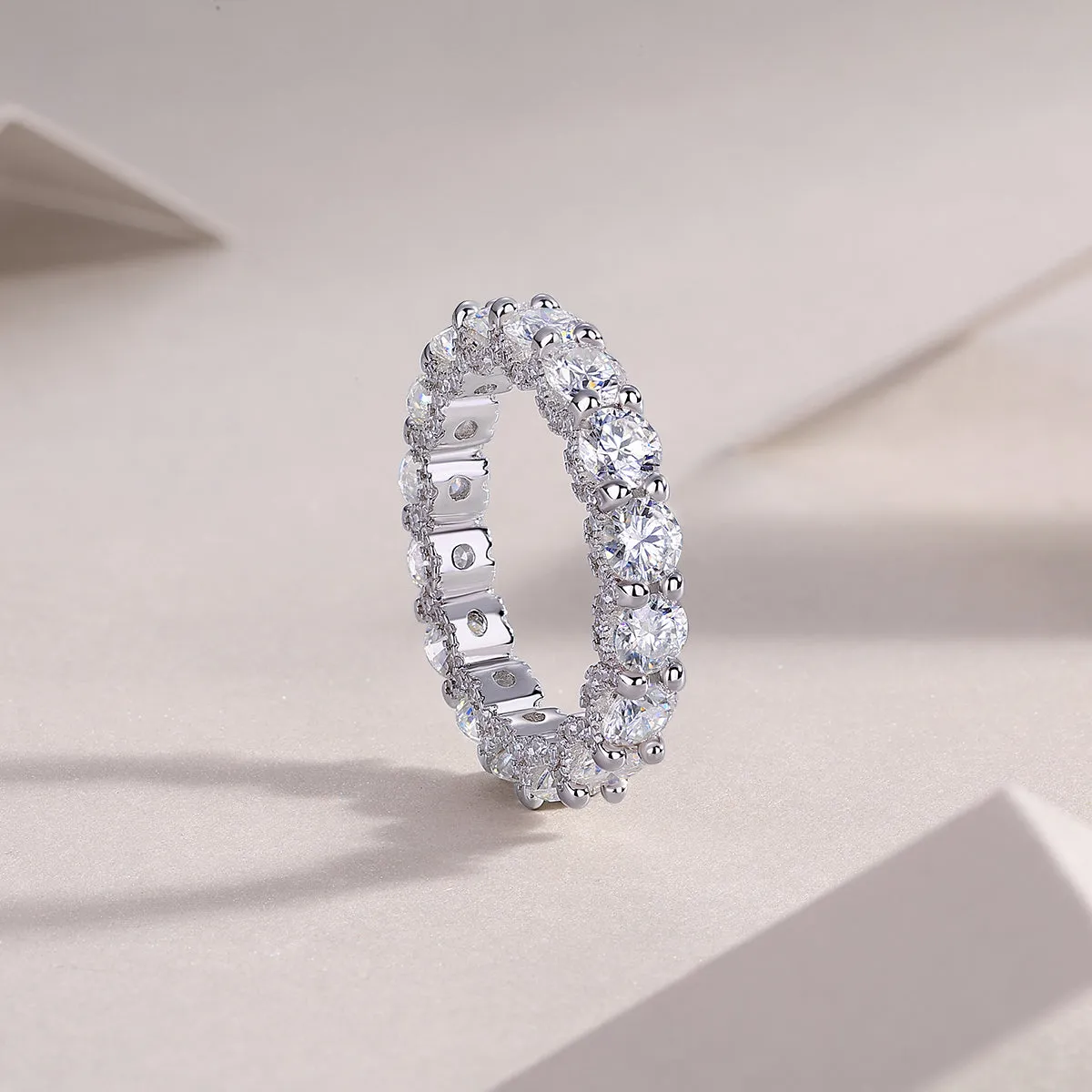 Ferris Wheel moissanite ring set in S925 silver with platinum plating on a white background
