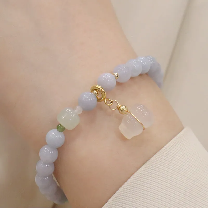 Women's gold-plated bracelet with artificial crystal and chalcedony pendant in climbing cat design