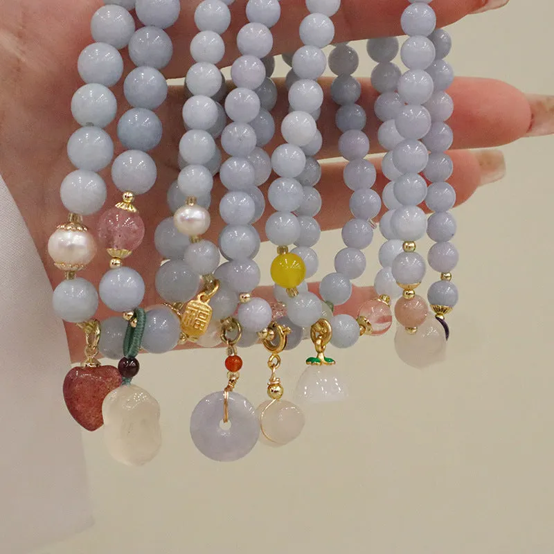 Women's gold-plated bracelet with artificial crystal and chalcedony pendant in climbing cat design