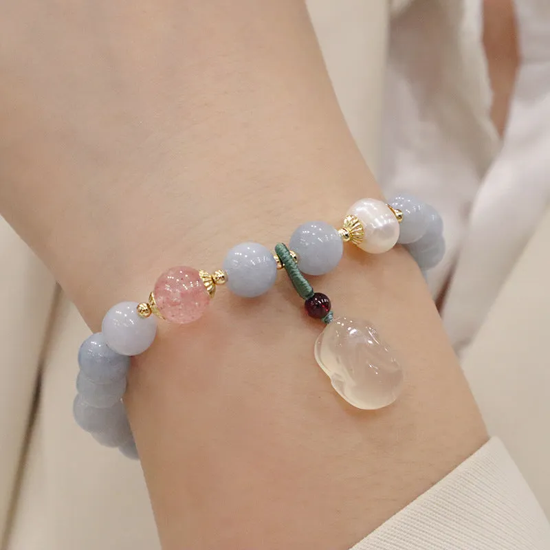 Women's gold-plated bracelet with artificial crystal and chalcedony pendant in climbing cat design