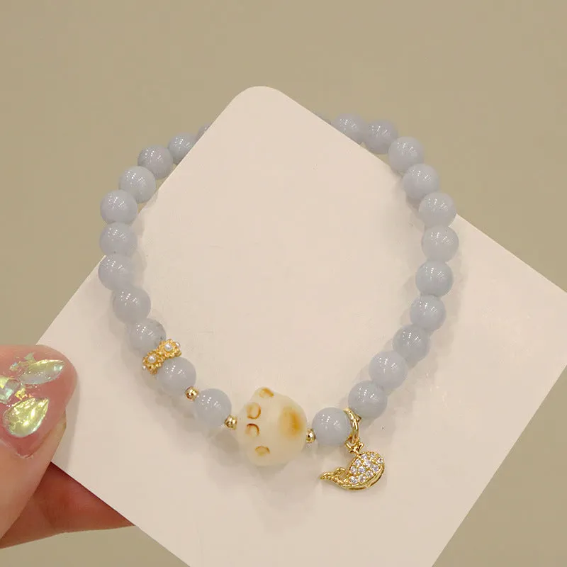 Women's gold-plated bracelet with artificial crystal and chalcedony pendant in climbing cat design