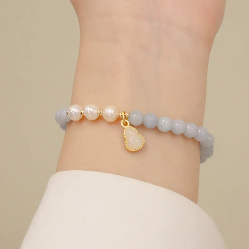Women's gold-plated bracelet with artificial crystal and chalcedony pendant in climbing cat design