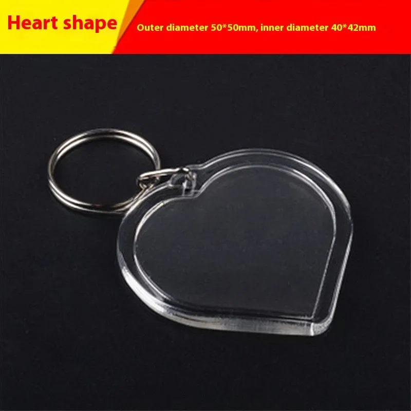 Transparent acrylic empty keychain shell in apple shape against a white background
