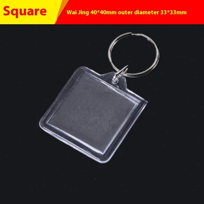 Transparent acrylic empty keychain shell in apple shape against a white background
