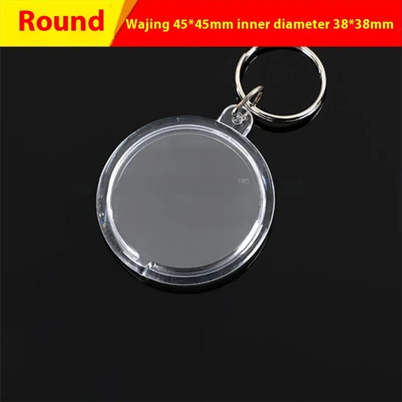 Transparent acrylic empty keychain shell in apple shape against a white background