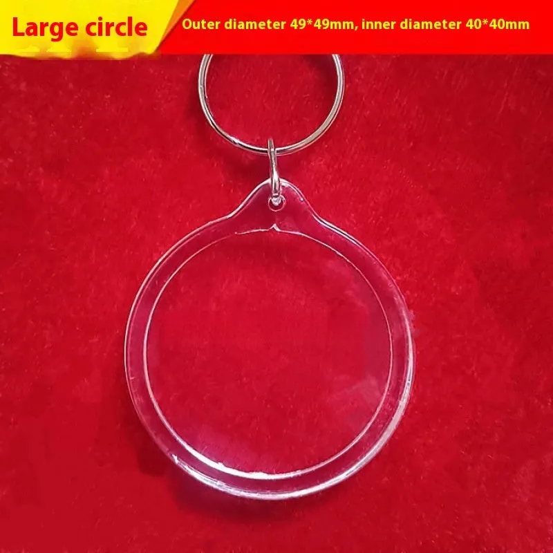 Transparent acrylic empty keychain shell in apple shape against a white background