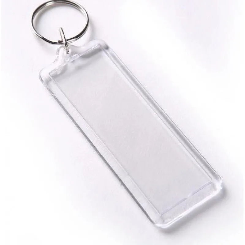 Transparent acrylic empty keychain shell in apple shape against a white background