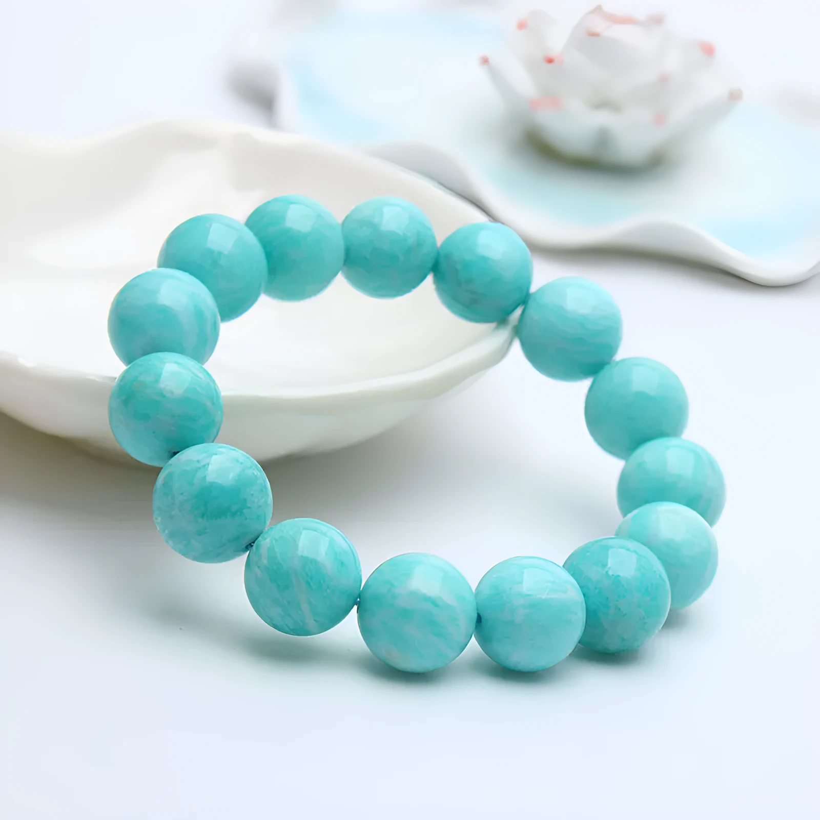 Amazonite gemstone bracelet with polished blue-green beads, shown in 8mm, 9mm, and 10mm size options.