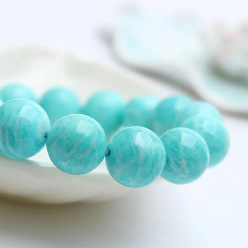 Amazonite gemstone bracelet with polished blue-green beads, shown in 8mm, 9mm, and 10mm size options.