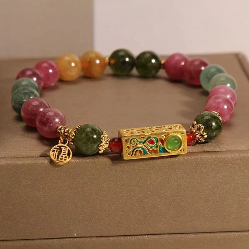 Pink crystal women's bracelet with geometric shape and electroplated finish in colour option selection.