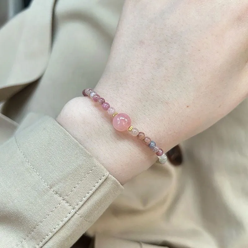 Pink crystal women's bracelet with geometric shape and electroplated finish in colour option selection.