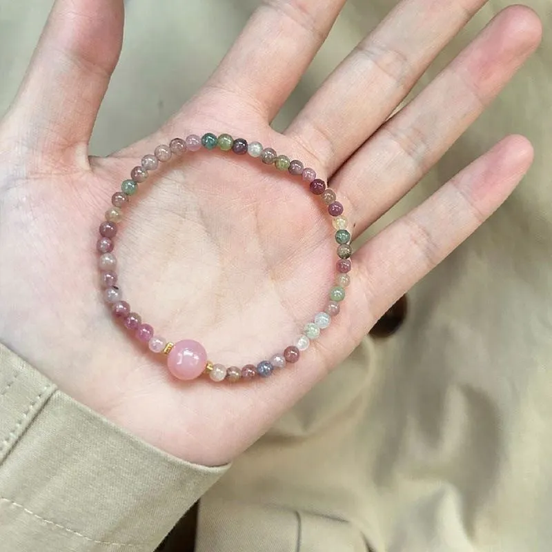 Pink crystal women's bracelet with geometric shape and electroplated finish in colour option selection.