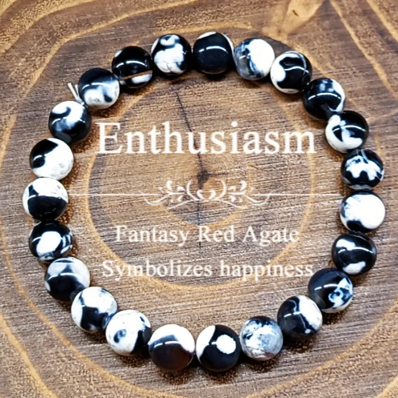 Close-up of a ladies bohemian bracelet with 8mm round glass beads in natural agate colours.