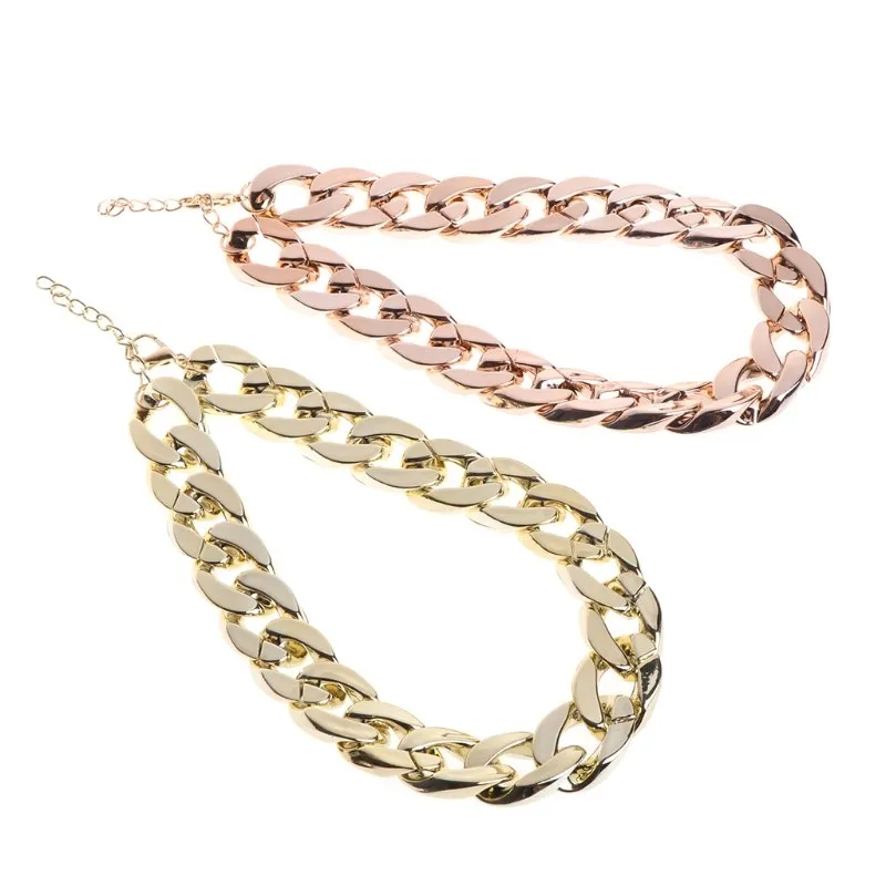 Gold plated plastic pet necklace with thick chain design on a small dog