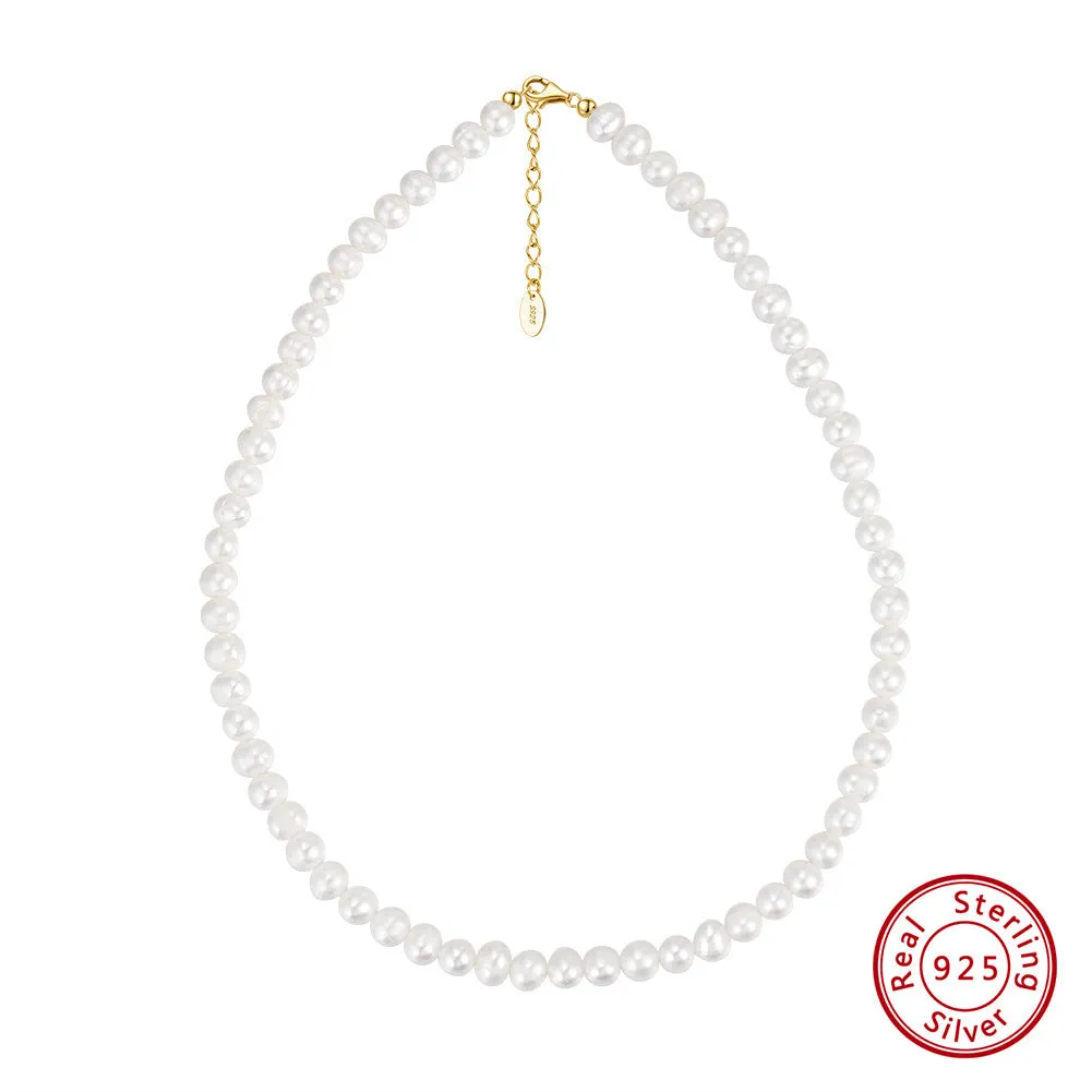 Women's silver necklace with round natural freshwater pearls on an adjustable chain.