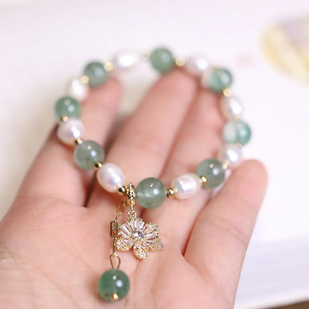 Green strawberry-shaped freshwater pearl bracelet with Chinese knot closure and small flower pendant
