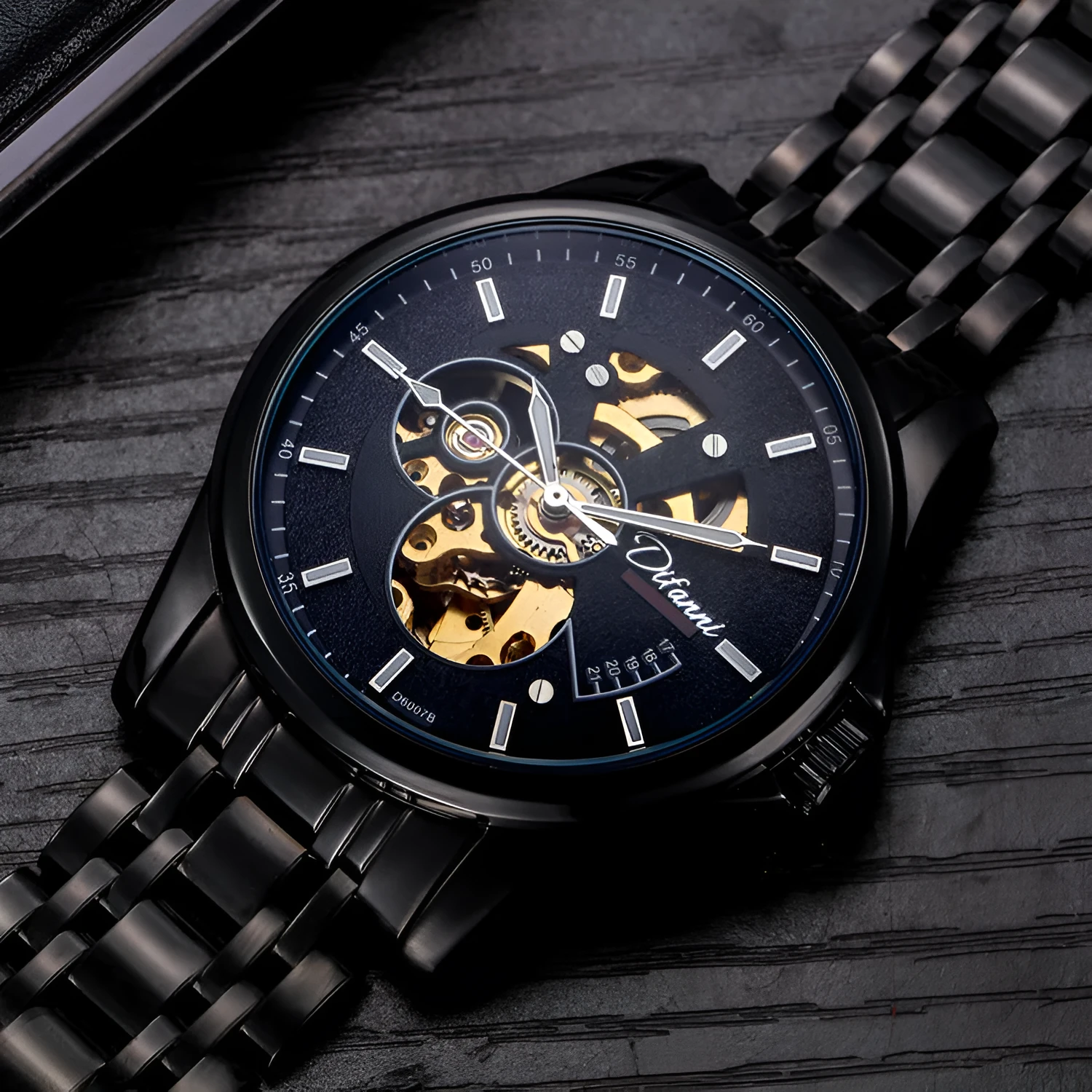 Mechanical automatic watch with 42mm stainless steel case, black dial, mineral glass, and steel bracelet on light background