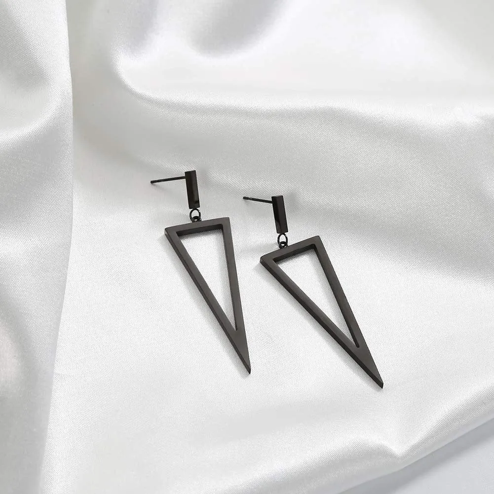 Black metal triangle earrings with electroplated finish on a plain background