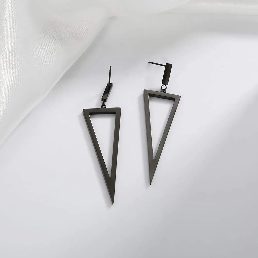 Black metal triangle earrings with electroplated finish on a plain background