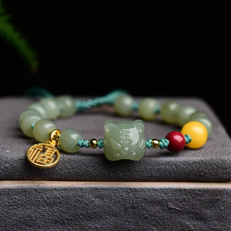 Natural Hetian jade bracelet with red cinnabar and amber beeswax beads, animal zodiac design