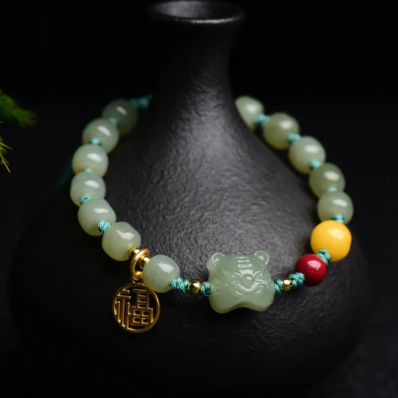 Natural Hetian jade bracelet with red cinnabar and amber beeswax beads, animal zodiac design