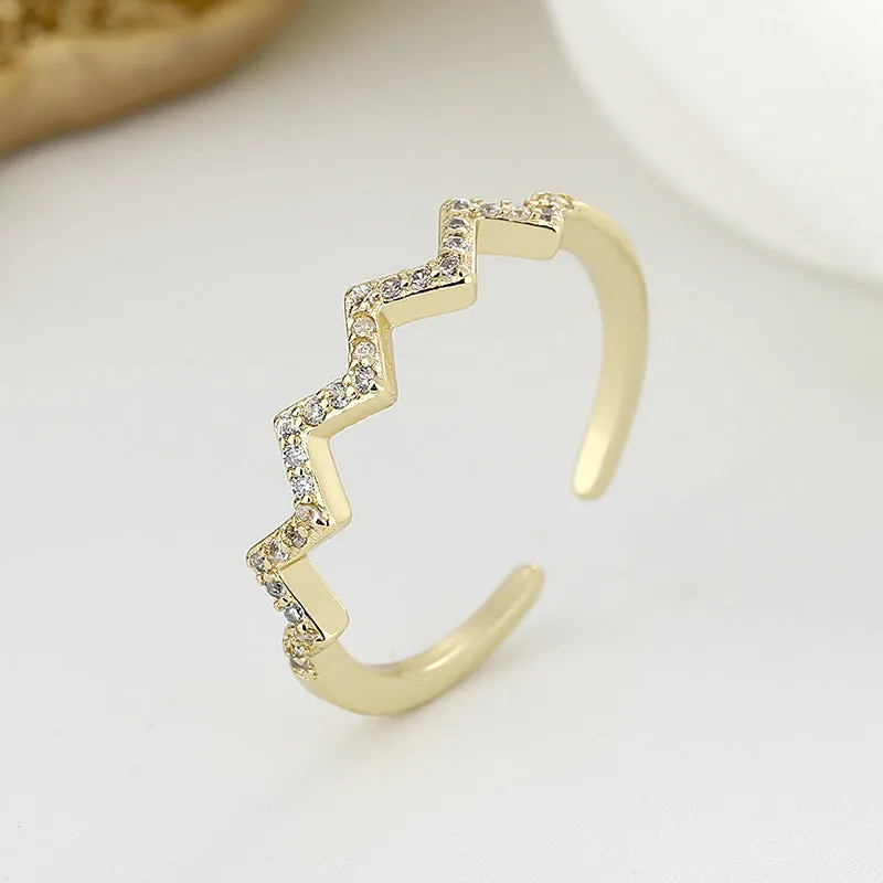 ECG Wave V-shaped zircon ring in gold colour on white background