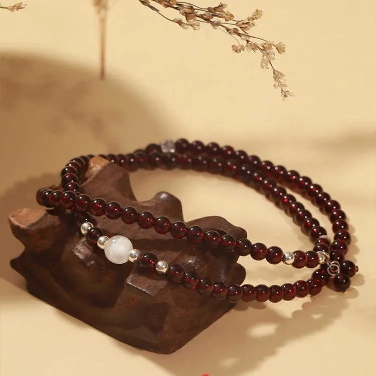 Antique style Chinese bracelet with U-shaped design and floral red garnet imitation gemstones
