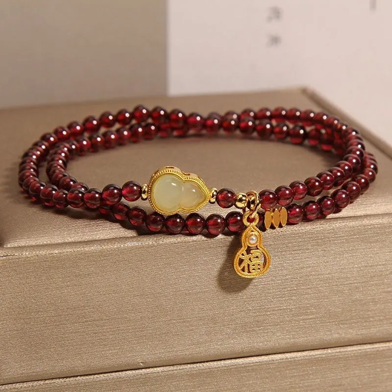 Antique style Chinese bracelet with U-shaped design and floral red garnet imitation gemstones