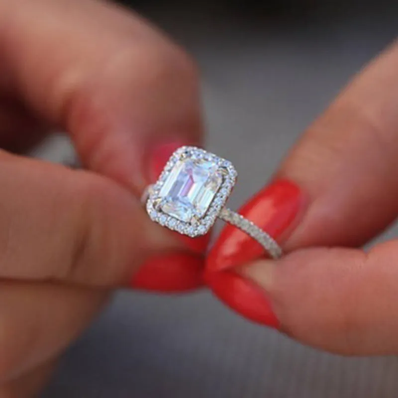 Silver rectangle princess ring with 3.5 carat emulation diamond on geometric band