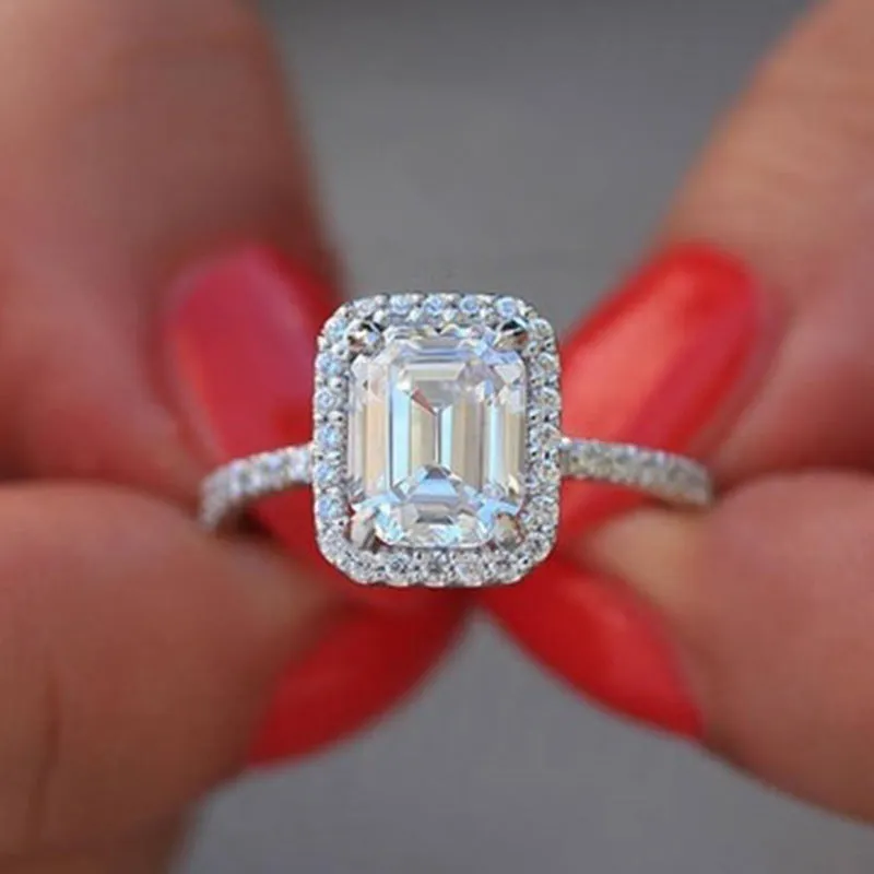 Silver rectangle princess ring with 3.5 carat emulation diamond on geometric band