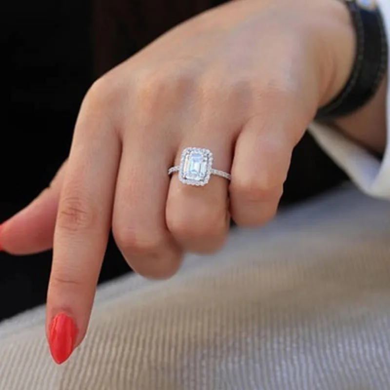 Silver rectangle princess ring with 3.5 carat emulation diamond on geometric band