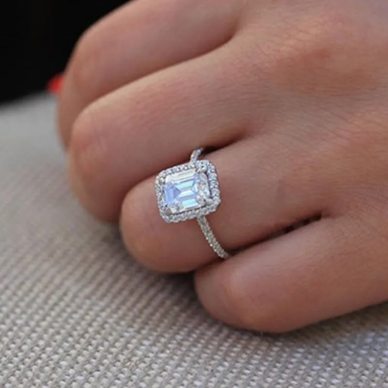 Silver rectangle princess ring with 3.5 carat emulation diamond on geometric band