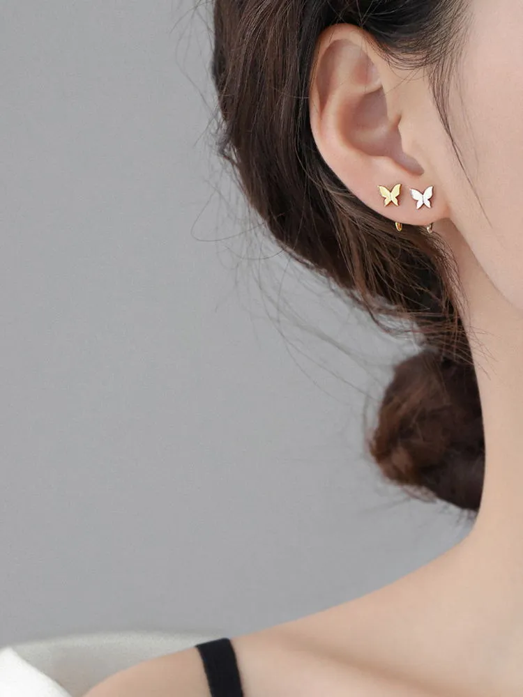 Pair of 925 silver butterfly stud earrings, 13x6mm, golden colour finish on grey background