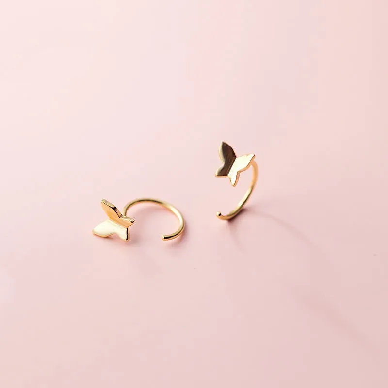 Pair of 925 silver butterfly stud earrings, 13x6mm, golden colour finish on grey background
