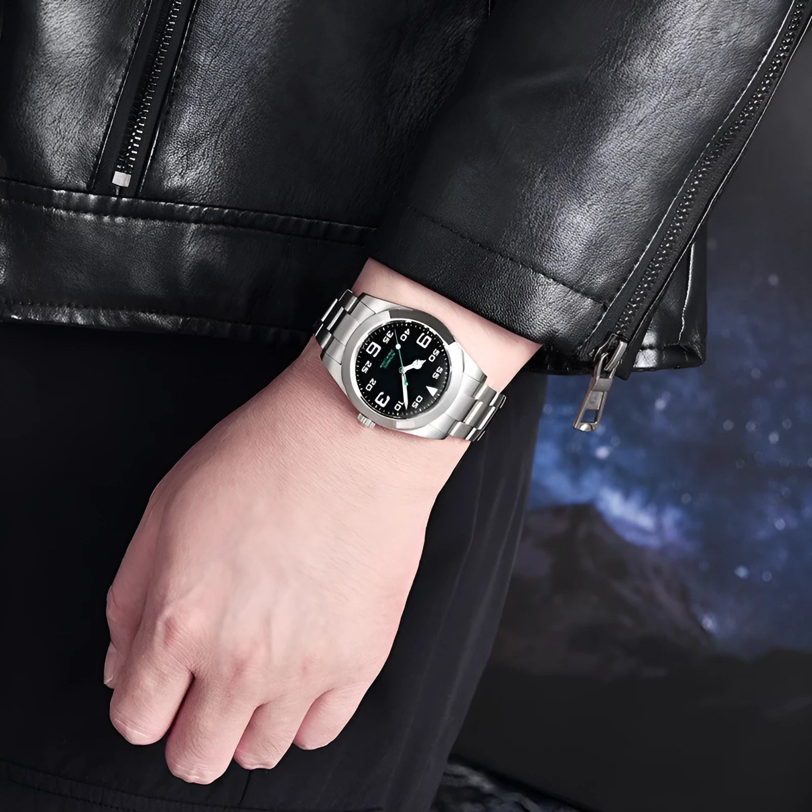 Men's automatic mechanical watch with 200m water resistance on stainless steel strap showing black dial with luminous hands and date window