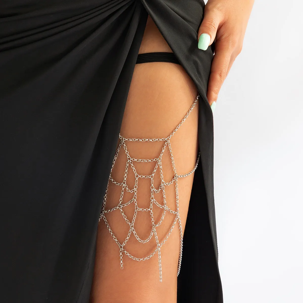 Women's simple geometric body chain in silver electroplated alloy, shown as an anklet