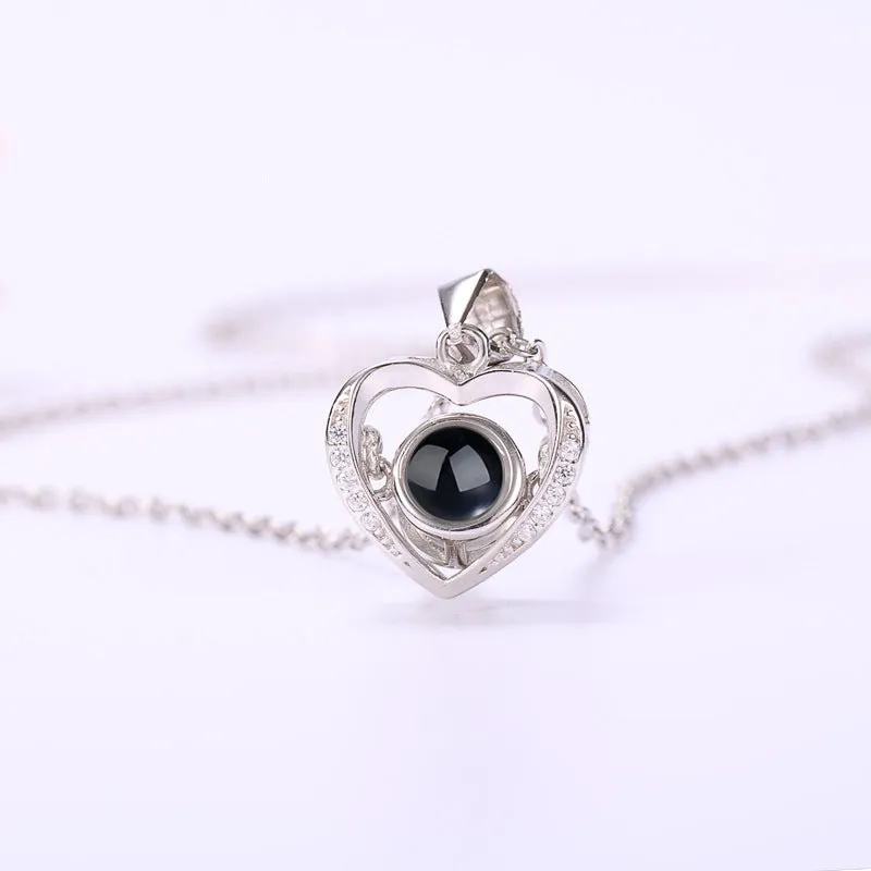 925 silver heart-shaped pendant necklace on cross chain with geometric detail and adjustable length