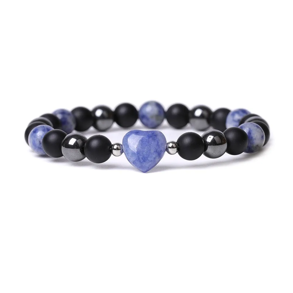 Hand-cut peach heart stone bracelet with geometric moon planet design in Tigereye colour
