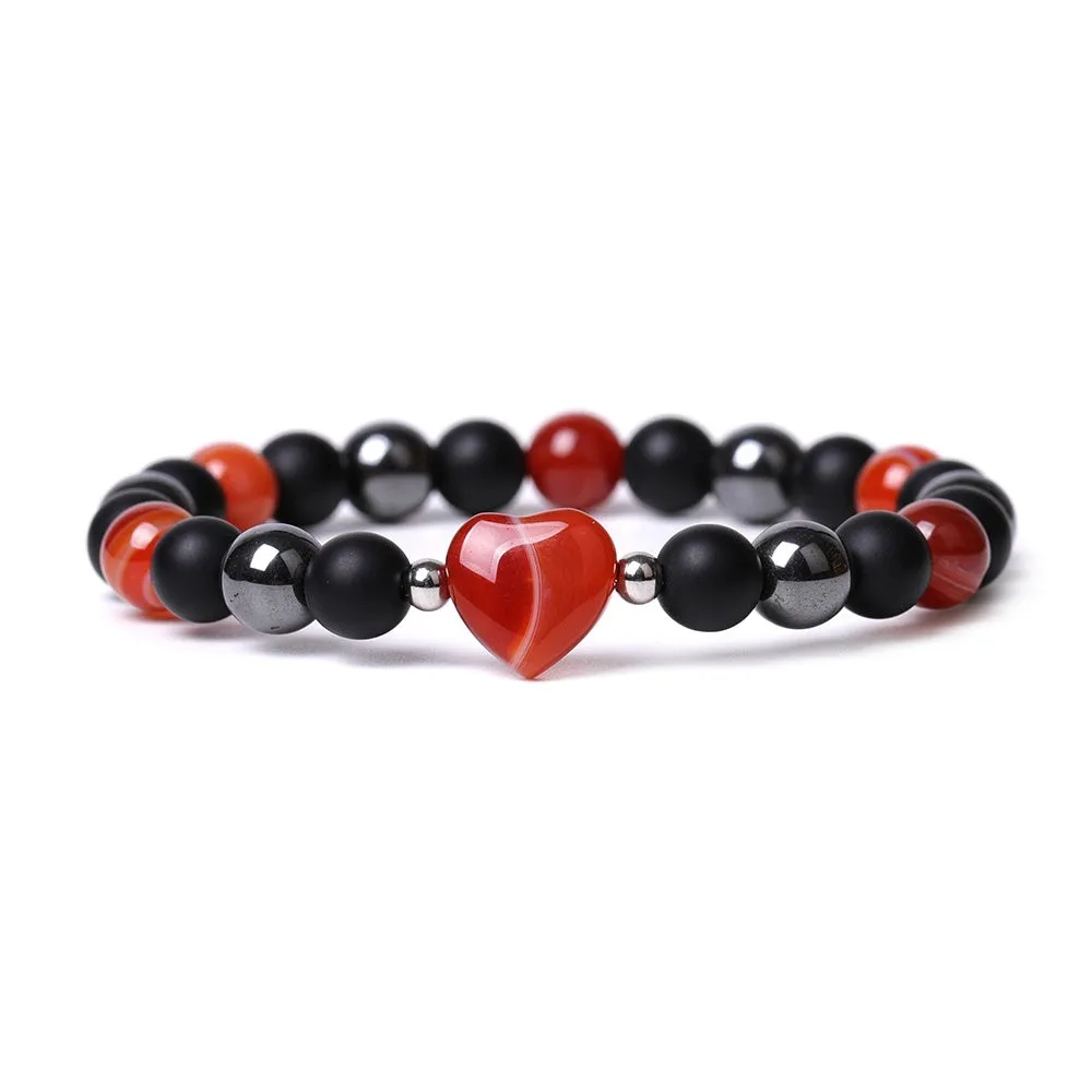 Hand-cut peach heart stone bracelet with geometric moon planet design in Tigereye colour