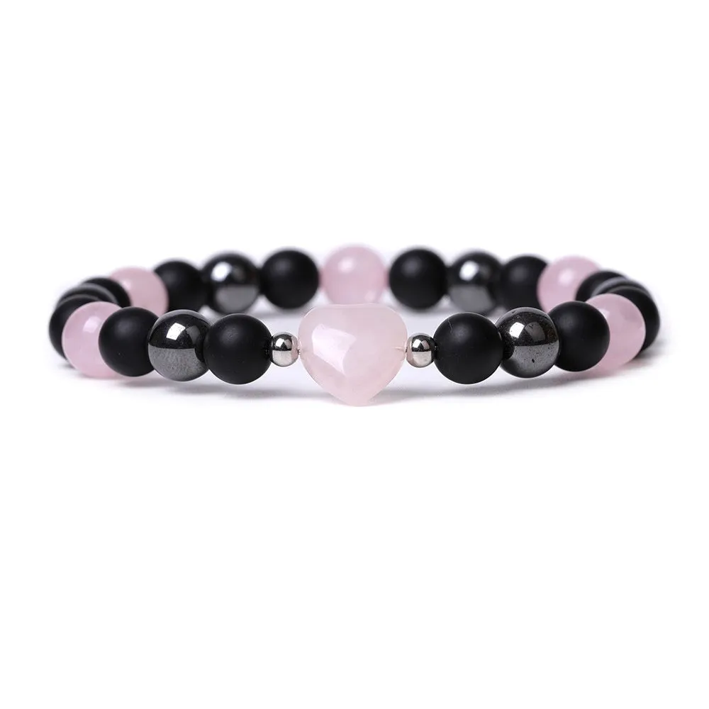 Hand-cut peach heart stone bracelet with geometric moon planet design in Tigereye colour